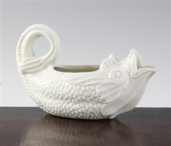 A soft paste porcelain dolphin sauceboat, 18th century, possibly Saint-Cloud or Mennecy, length 14.5cm (5.7in.)